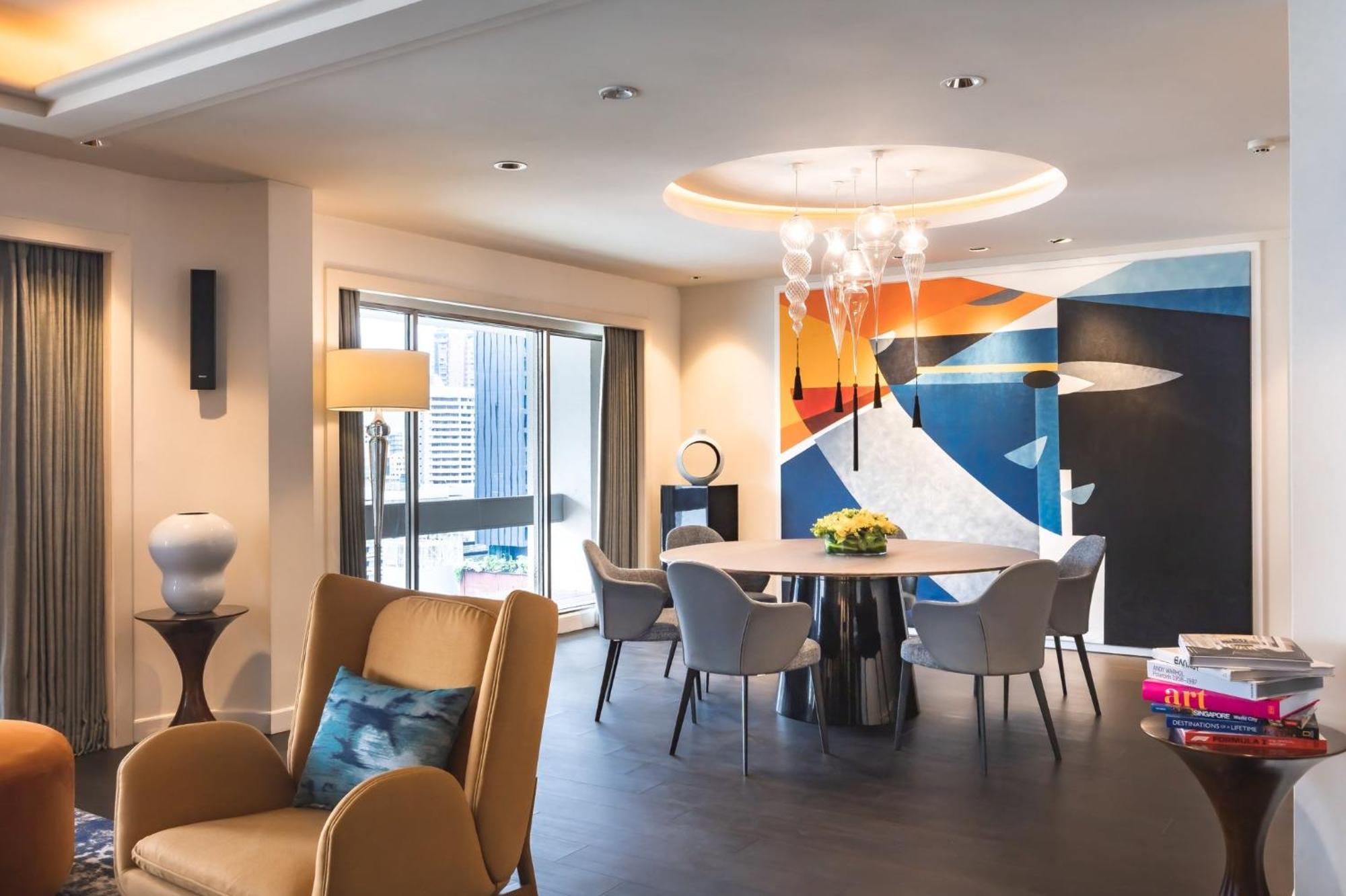 Voco Orchard Singapore By Ihg Extérieur photo The dining room of a three-bedroom apartment at The Ritz-Carlton, Hong Kong